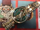A watch is shown with the time being broken.