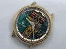 A watch with some parts missing on the side of it