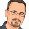 A man with glasses and a goatee.